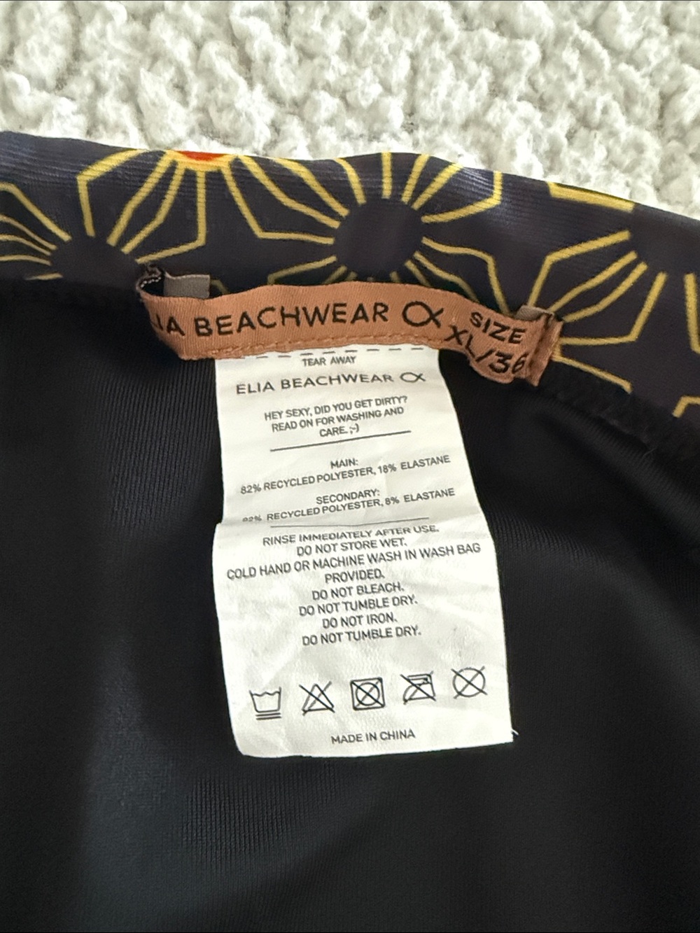 Men's Black Swim Briefs with Orange Starburst Print - Picture 6 of 6